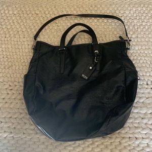 TuMi black leather bag! Used once. Measures 14 x 14 x 6 inches.